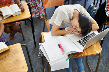 Image showing University, classroom and woman sleeping in exam with fatigue, education and burnout. College, learning and tired student with book, exhausted and rest in test, assessment or studying with high angle