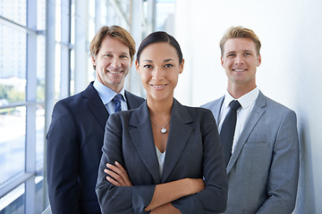 Image showing Teamwork, crossed arms and portrait of business people for pride, confidence and collaboration in hallway. Corporate lawyers, professional and men and woman for partnership, leadership and about us