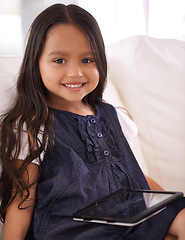 Image showing Portrait, happy girl and child with tablet on sofa for entertainment, internet or social media at home. Face of female person or little kid with smile, technology or ebook in living room at house