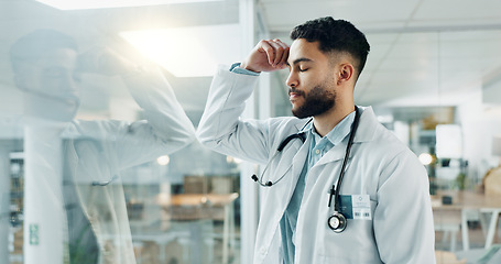 Image showing Man, doctor and stress at hospital, patient health and medical compliance for medicine, cancer and wellness test. Burnout, depression and healthcare worker with anxiety, mental health and headache