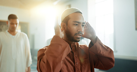 Image showing Muslim, praying and man in a Mosque for spiritual religion together as a group to worship Allah in Ramadan. Islamic, Arabic and holy people with peace or respect for gratitude, trust and hope