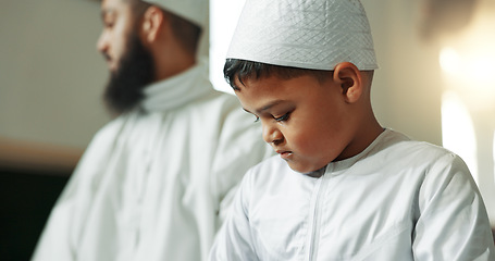 Image showing Muslim, praying and man with child in mosque for learning, religious education and worship or prayer. Islamic community, religion and person and kid for Ramadan Kareem, Eid Mubarak and teaching Quran