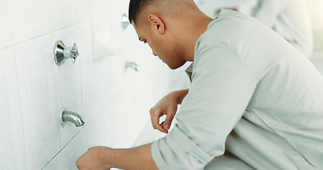 Image showing Muslim, religion and man ear washing for prayer in bathroom for purity, and cleaning ritual. Islamic, worship and faith of group of people with wudu together at a mosque or temple for holy practice