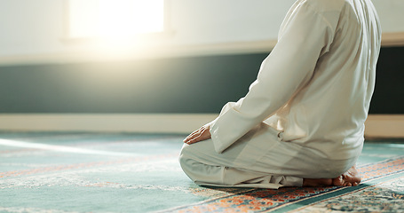 Image showing Praying, Muslim and man with faith in a mosque for praying, peace and spiritual care in holy religion for Allah. Respect, Ramadan and Islamic person with kindness, hope and humble after worship