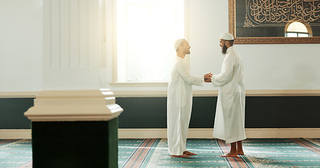 Image showing Muslim, handshake and people in mosque for greeting, conversation and respect in Islamic community. Worship, friends and men shaking hands in religious building for Ramadan Kareem, prayer and support