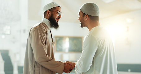 Image showing Muslim, handshake and people in mosque for greeting, conversation and respect in Islamic community. Worship, friends and men shaking hands in religious building for Ramadan Kareem, prayer and support