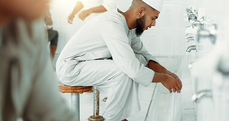 Image showing Muslim, hygiene and men washing before prayer in bathroom for purity, and cleaning ritual. Islamic, worship and faith of group of people with wudu together at a mosque or temple for religion practice