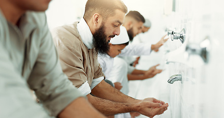 Image showing Muslim, religion ritual and men washing before prayer in bathroom for purity, and cleaning. Islamic, worship and faith of group of people with wudu together at a mosque or temple for holy practice