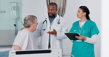 Image showing Doctor, nurse and patient in discussion in hospital got medical diagnosis or treatment plan. Clipboard, consultation and team of healthcare workers talking to a senior man with checklist in a clinic.