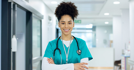 Image showing Healthcare, face and woman or nurse with arms crossed for wellness, trust and service in hospital or clinic. Portrait, person or doctor with happiness for career, cardiology or nursing at workplace