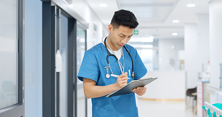 Image showing Doctor, planning and writing in documents, medical checklist or charts for hospital notes or clinic service. Healthcare worker, asian man or nurse smile for clipboard, paperwork or thinking in clinic