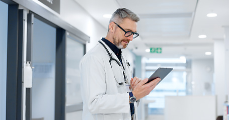 Image showing News, tablet or mature doctor in hospital with research on website to search for medicine info online. Man reading, senior or medical healthcare nurse browsing on technology for telehealth in clinic