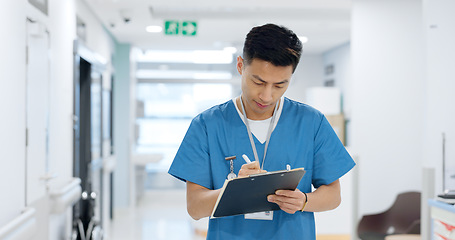 Image showing Doctor, planning and writing in documents, medical checklist or charts for hospital notes or clinic service. Healthcare worker, asian man or nurse smile for clipboard, paperwork or thinking in clinic