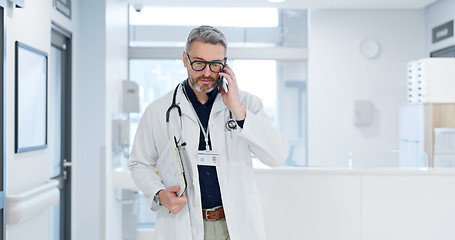 Image showing Phone call, doctor and man walking in hospital, talking or conversation for healthcare. Smartphone, smile and medical professional with documents for communication, consulting or telehealth in clinic