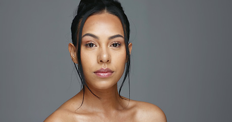 Image showing Face, skincare and beauty of woman in studio isolated on a gray background mockup space. Portrait, natural and serious model in spa facial treatment for aesthetic, cosmetic and wellness for health