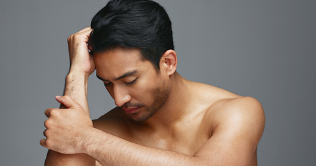 Image showing Face, cosmetics and Asian man with beauty, wellness and dermatology on a grey studio background. Portrait, Japanese person or model with healthy skin, luxury treatment and spa grooming with aesthetic