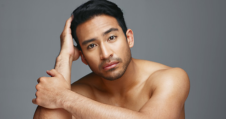 Image showing Face, cosmetics and Asian man with beauty, wellness and dermatology on a grey studio background. Portrait, Japanese person or model with healthy skin, luxury treatment and spa grooming with aesthetic