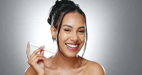 Image showing Tampon, face and happy woman with feminine hygiene product, menstruation and wellness on grey background. Female health, reproductive and protection, period with sanitary tools in portrait in studio