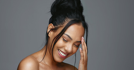 Image showing Face touch, skincare and smile of woman in studio isolated on gray background. Portrait, natural beauty and hand of model in spa facial treatment for aesthetic, glow and cosmetic wellness for health