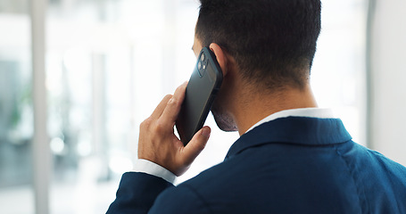 Image showing Startup, deal or back of businessman on a phone call talking, networking or speaking of ideas in office. Listening, mobile communication or male entrepreneur in conversation for a negotiation offer