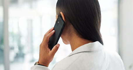 Image showing Startup, deal or back of businesswoman on a phone call talking, networking or speaking of ideas in office. Listening, mobile communication or entrepreneur in conversation for a negotiation offer