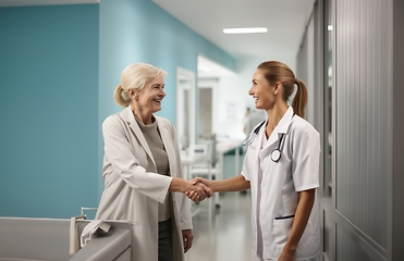 Image showing A compassionate doctor shares a handshake with her patient, signifying a successful and trustful completion of hospital treatment