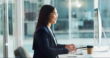 Image showing Business woman, typing on computer and happy copywriting, online planning and office software. Young worker, editor or writer working on desktop for research, report or editing of company newsletter