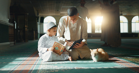 Image showing Quran, child and man teaching in a mosque for praying, peace and spiritual care in holy religion for Allah. Reading book, learning or Muslim person with tablet, kid or education to help worship God