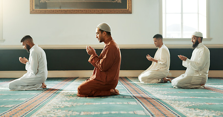 Image showing Islamic, praying and holy men in a Mosque for spiritual religion together as a group to worship Allah in Ramadan. Muslim, Arabic and people with peace or respect for gratitude, trust and hope