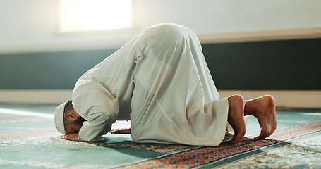 Image showing Praying, Muslim and man with faith in a mosque for praying, peace and spiritual care in holy religion for Allah. Respect, Ramadan and Islamic person with kindness, hope and humble after worship