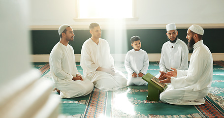 Image showing Muslim, religion and people in mosque for praying, religious education and worship or prayer. Islamic community, knowledge and men talking on carpet for Ramadan Kareem, learning Quran and Eid Mubarak