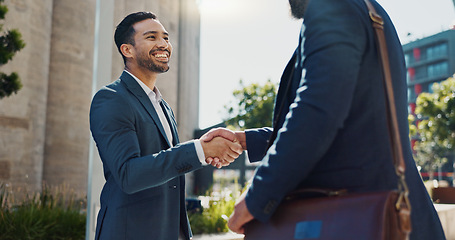 Image showing City, business people and handshake with happy employees and smile from project deal and success. Conversation, teamwork and outdoor with staff and urban building with speaking and shaking hands