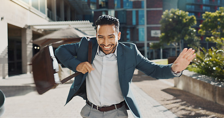 Image showing Business, outdoor and dancing with man, celebration and smile with happiness and promotion. Expression, Japanese person or entrepreneur with movement or energy with professional, achievement or bonus