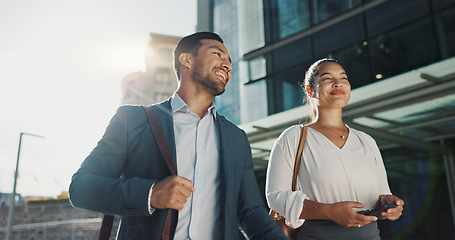 Image showing Business people, walking and travel in city with discussion on morning commute, partnership and happy. Employees, man and woman with conversation, collaboration and networking outdoor in urban town