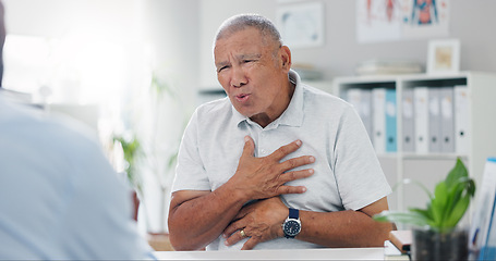 Image showing Senior, man and consulting doctor on chest pain, sore or discomfort in healthcare hospital. Mature, male person or patient talking to medical employee for heart ache, breathing or illness at clinic