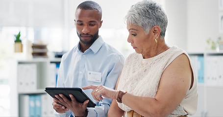 Image showing Doctor with tablet and senior woman consulting physiotherapist for results, feedback or recovery plan. Chiropractic, advice and elderly client in consultation room for help, discussion or support at