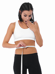 Image showing Shocked woman, tape measure and weight loss of waist for slim body or diet on a white studio background. Surprised female person, athlete or healthy model checking size or waistline on mockup space