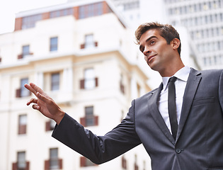 Image showing Businessman, travel and taxi hand sign in a city street for morning commute, signal or gesture outdoor. Finger, emoji or lawyer with symbol for metro transportation, cab or bus, service or chauffeur