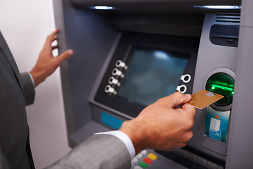 Image showing Businessman, hands and credit card at ATM machine for banking, cash withdrawal or money transfer on account. Closeup of man or investor inserting debit for fintech, interaction or electronic deposit