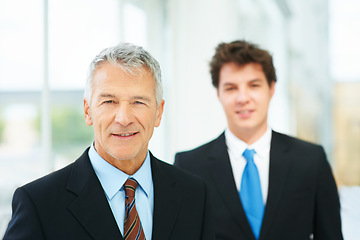 Image showing Mature, businessman and professional portrait in company with boss of team in London. Happy, manager and man in lobby with leadership, pride and confidence in business with person on staff in office