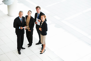 Image showing Top view, portrait and business people in a lobby, teamwork and smile with mockup space and cooperation. Group, manager or employees with collaboration or partnership with ideas, professional or plan