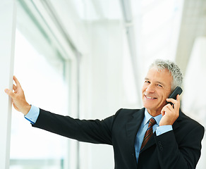 Image showing Mature employee, smile and phone call in office building talking to boss of corporate company for business. Executive, chat and happy for job in workplace, technology and connect for communication