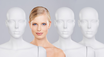 Image showing Woman, mannequins and portrait for identity, skincare and individuality on studio background. Person, beauty and dummy with face for creativity and cosmetics or unique ideas for satisfaction and skin