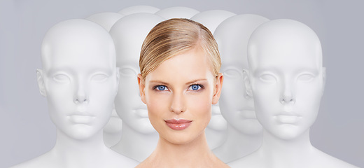 Image showing Woman, mannequins and portrait for identity, beauty and individuality on studio background. Person, skincare and dummy with face for creativity and cosmetics or unique ideas for satisfaction and skin