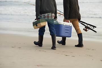 Image showing Walk, fishing and men on beach together with cooler, tackle box and holiday adventure. Ocean, fisherman and friends with rods, bait and tools for hobby at waves on winter morning vacation at sea.