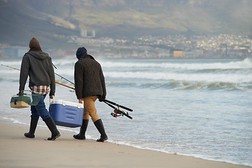 Image showing Ocean, fishing and men walking at waves together with cooler, tackle box and holiday conversation. Beach, fisherman and friends with rods, bait and tools on winter morning vacation with mockup space