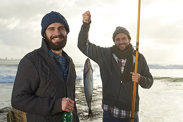 Image showing Happy, people and fishing portrait at sea with pride for tuna catch at sunset. Fisherman, friends and smile holding fish and rod in hand on holiday, adventure or travel in nature on vacation at ocean