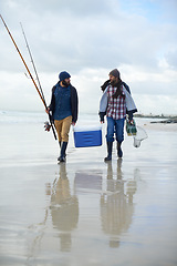 Image showing Fisherman, friends and walking on beach for fishing in the morning by sea with happiness, equipment or sky. Friendship, men and net with bonding, travel or rod by water for hobby, holiday or activity