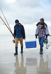 Image showing Waves, fishing and men walking on beach together with cooler, tackle box and holiday conversation. Ocean, fisherman and friends with rods, bait and tools in nature on winter morning vacation at sea.