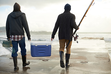 Image showing Back, beach and fishing, men, cooler and early overcast morning with vacation and hobby. Rear view, people and friends with a cold box and rod with ocean and weekend break for activity and holiday